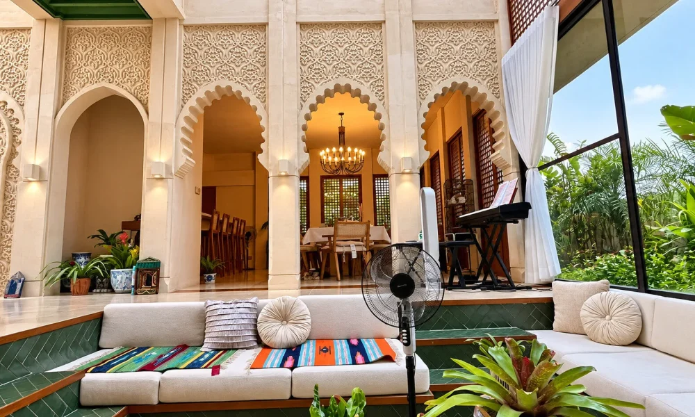 Luxury interior with decorative wall finishes, ornate arches, carved details, chandelier, and elegant lounge seating – Nova Roma, formerly Vasari.
